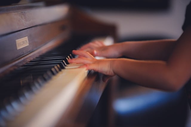 Hands playing piano during a memorial service, creating a peaceful and reflective atmosphere, often arranged by funeral homes in Rohnert Park, CA for funeral ceremonies and tribute gatherings.