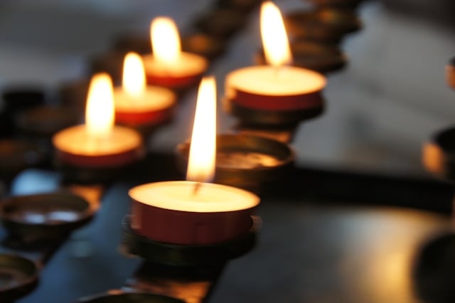 Memorial candles glowing softly during a peaceful remembrance service in Santa Rosa, CA.