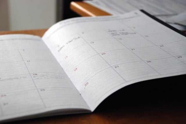 Open planner calendar for organizing funeral arrangements and memorial service planning in Windsor, CA.